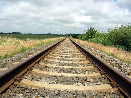 Why are there crushed stones alongside rail tracks